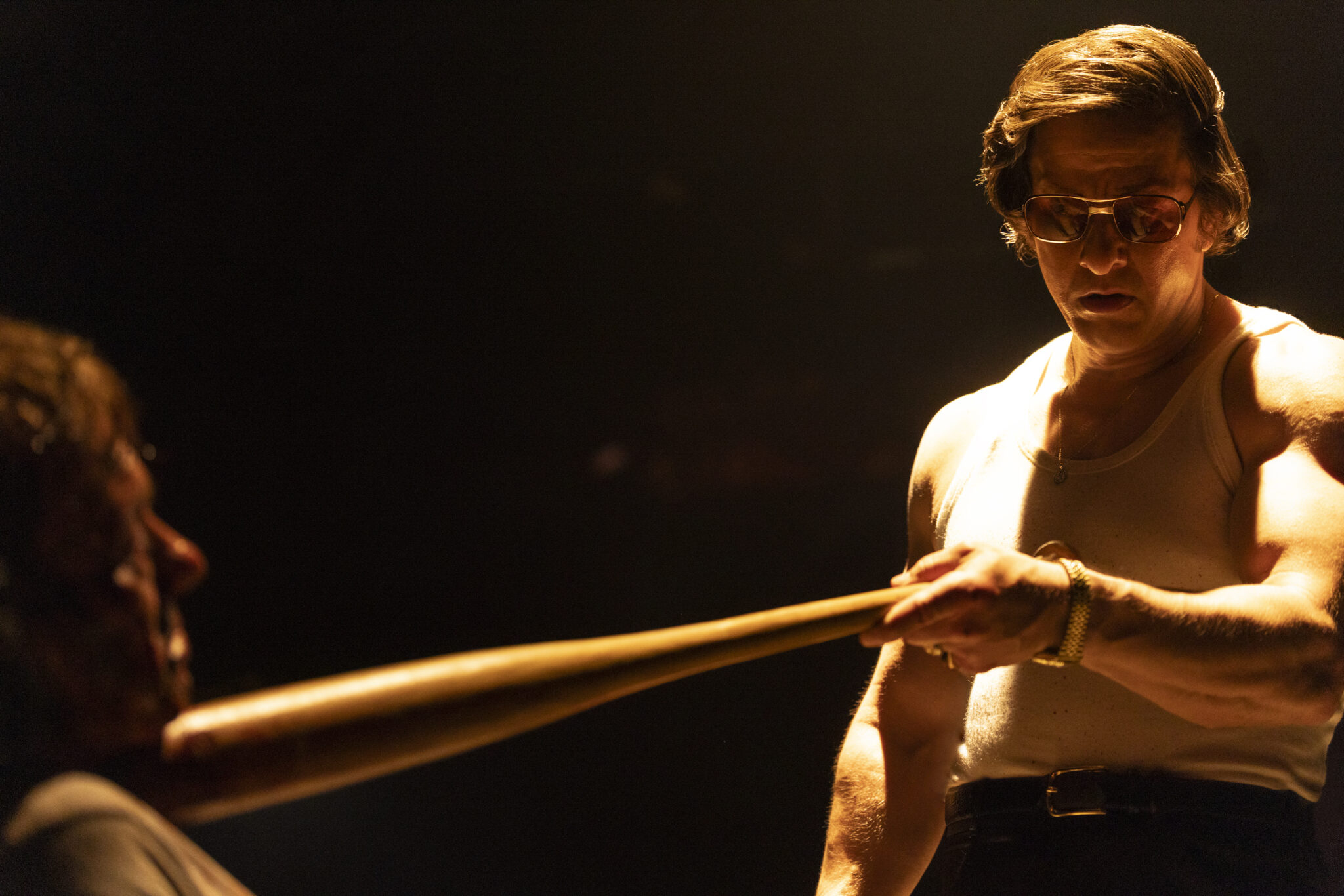Mark Wahlberg holds a pool cue in an official still from By Any Means (2026)