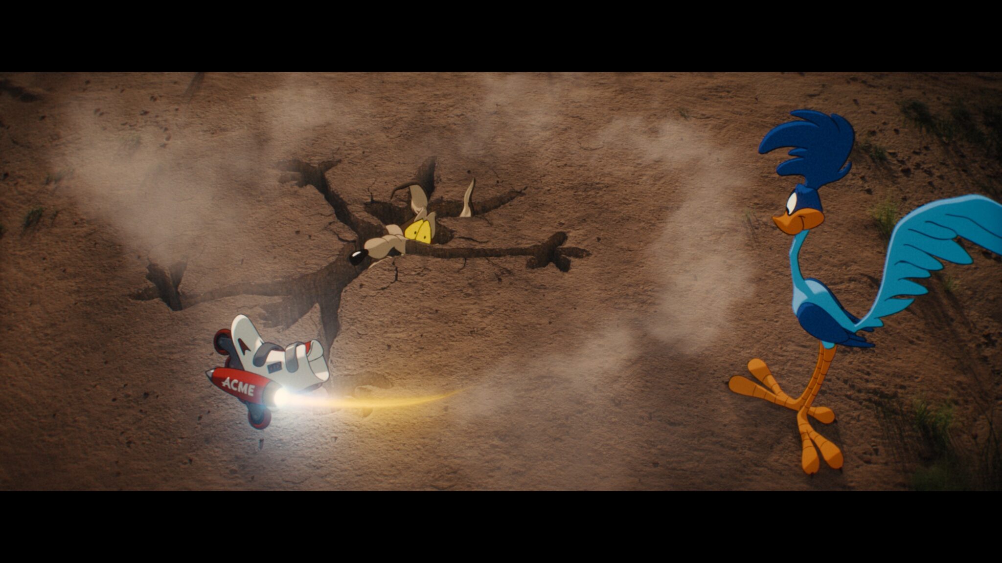 Wile E. Coyote and the Road Runner beside a miniature ACME rocket in Coyote vs. Acme (2026)
