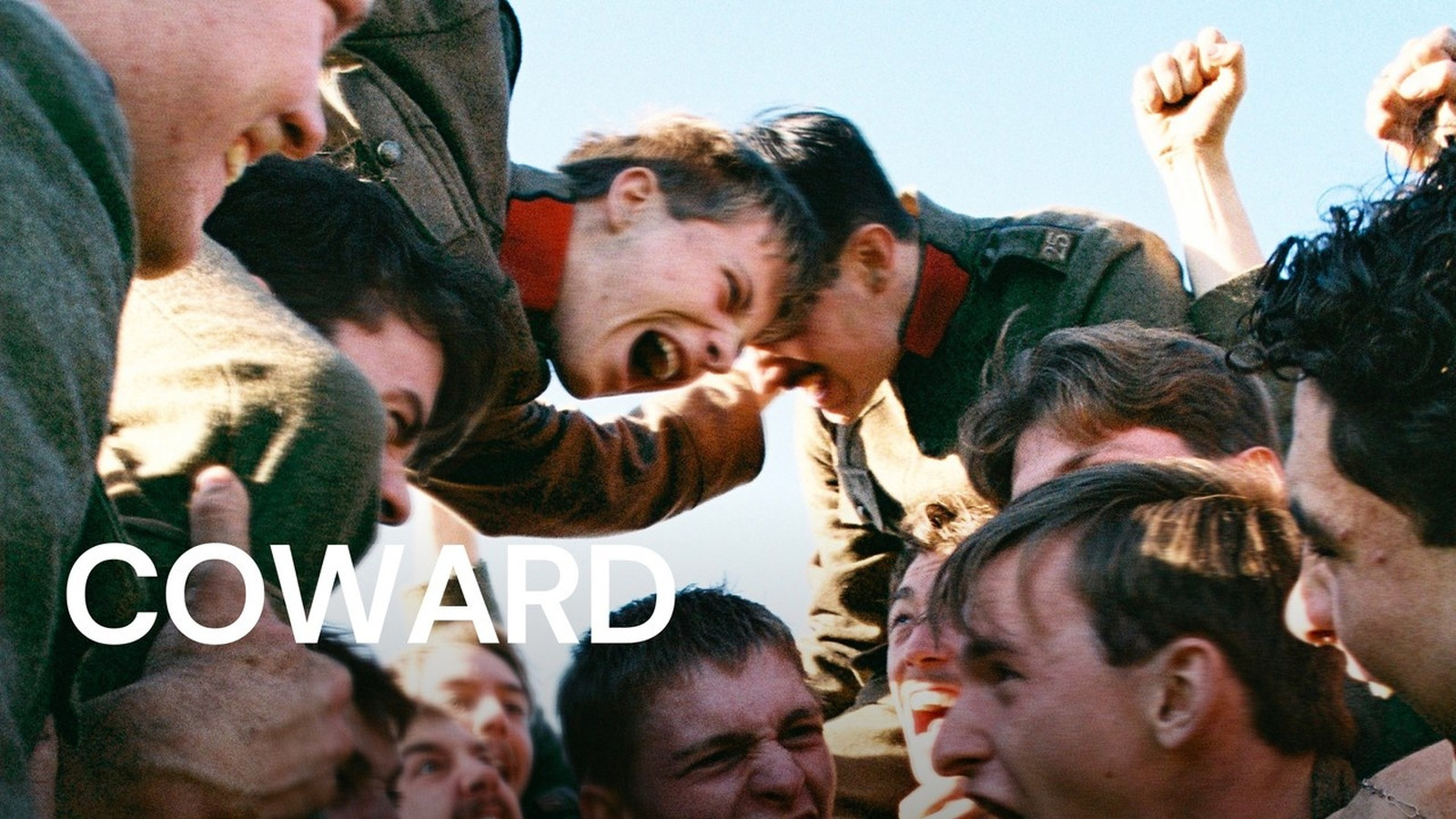 Official MUBI artwork for Coward: young First World War soldiers in khaki tunics shouting and celebrating as one is lifted above the crowd against a pale blue sky, with the COWARD title