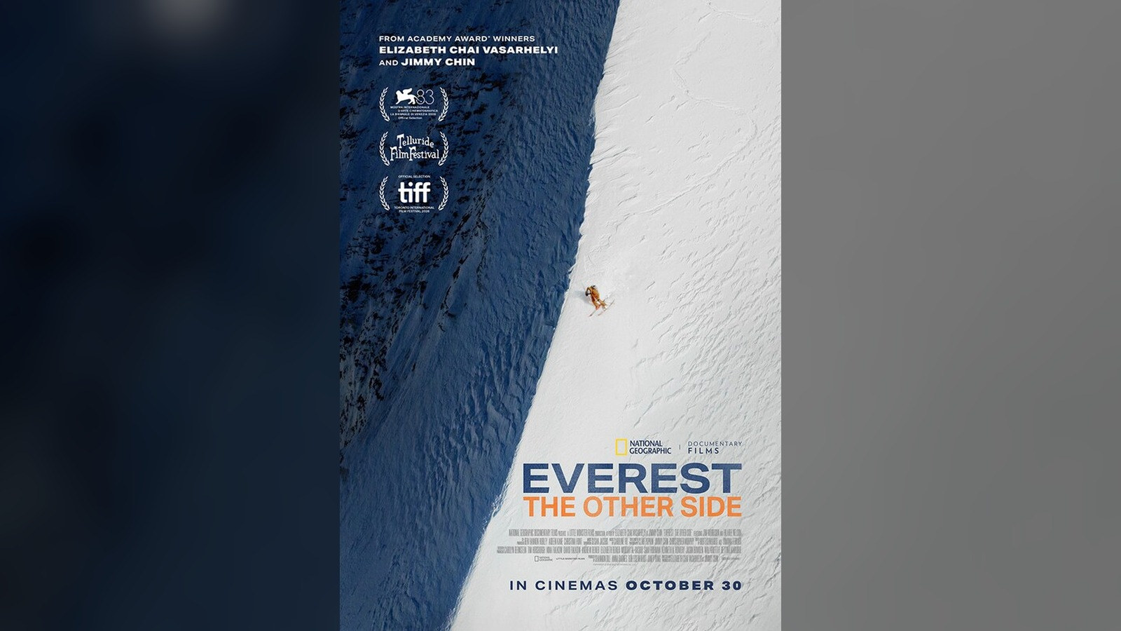 Official UK poster for Everest: The Other Side: a lone skier on a vast steep snow face beside a dark shadowed ridge, with the title and In cinemas October 30
