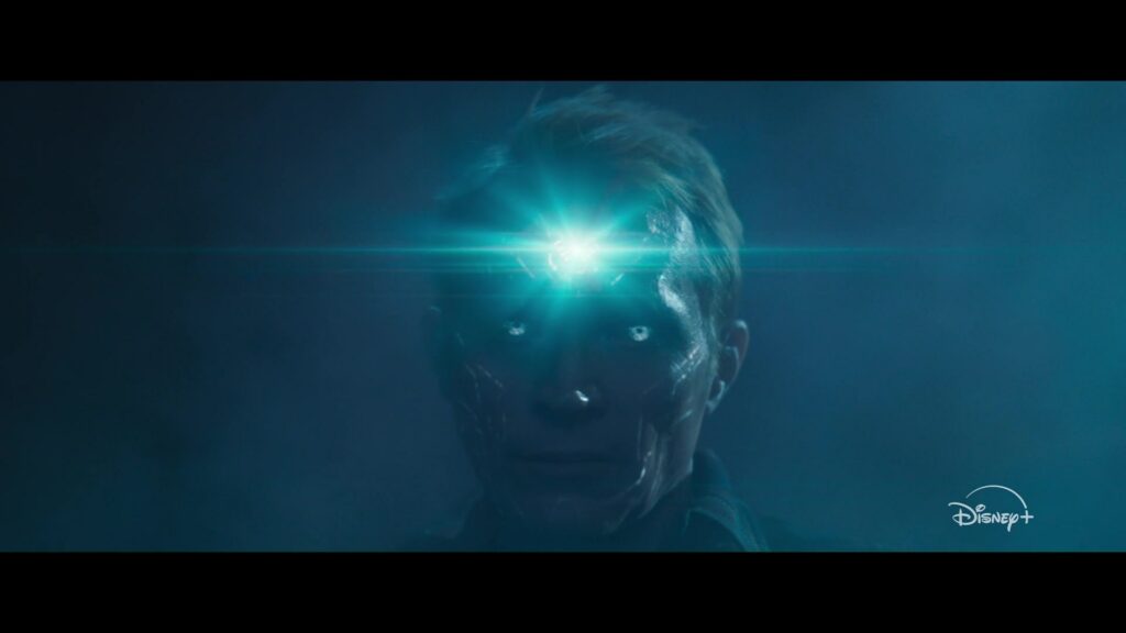 An intact VisionQuest trailer frame shows Vision in close-up with a glowing forehead and the original Disney+ mark.