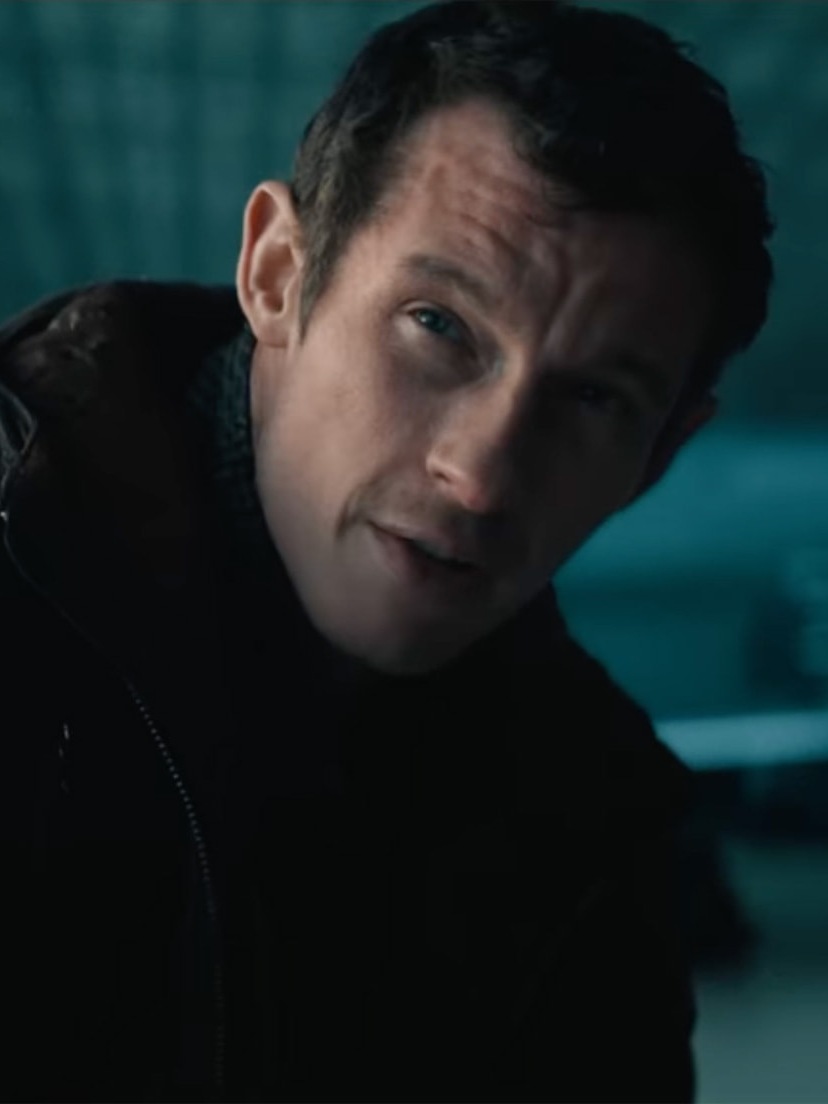 Callum Turner in a dark jacket in Neuromancer
