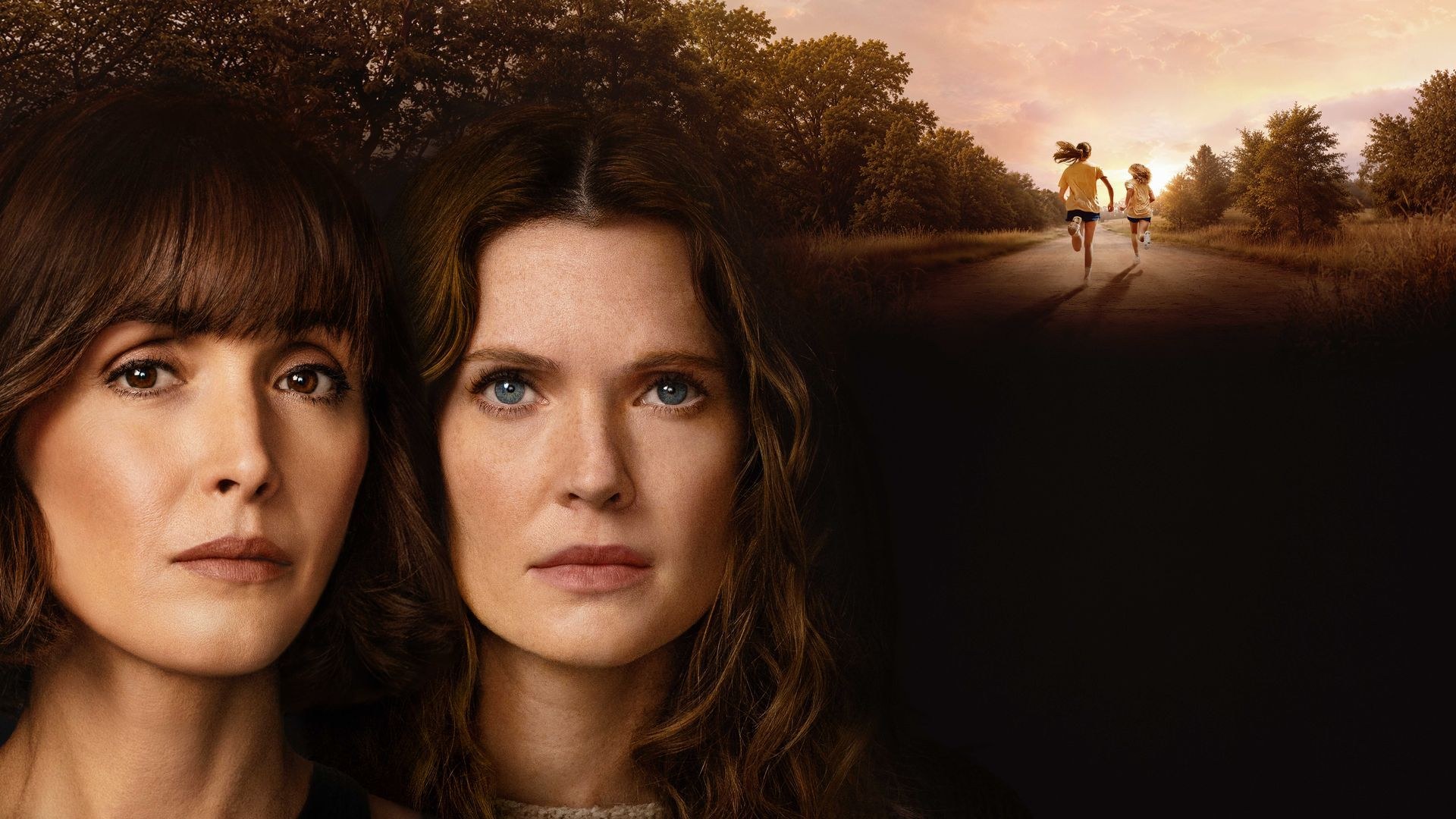 Official key art for The Good Daughter showing Rose Byrne and Meghann Fahy side by side, with two young girls running down a country road at sunset in the background